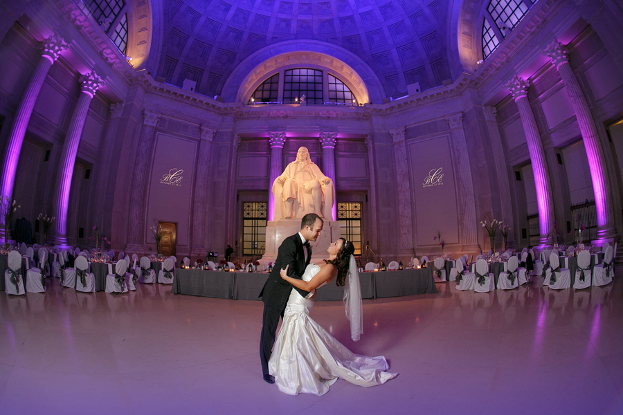 groom dips bride at franklin institute on wedding day
