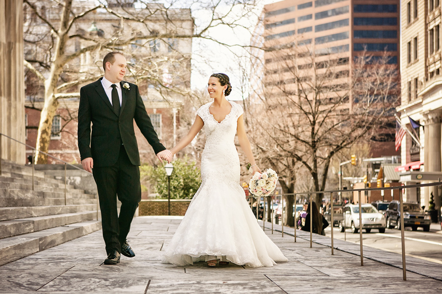 Bride and groom walking to downtown club in Philadelphia